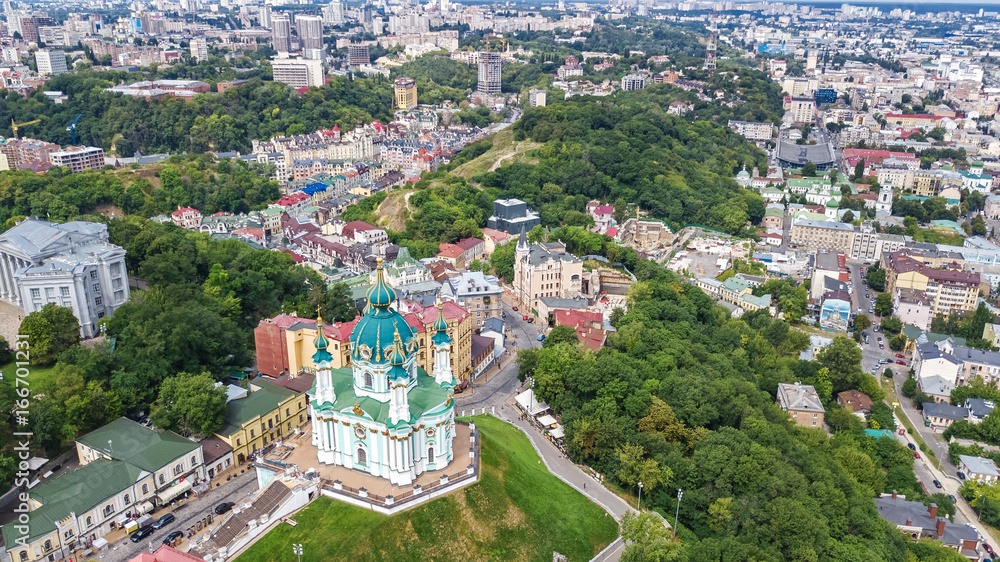 Aerial top view of Saint Andrew's church and Andreevska street from above, Podol district, city of Kiev (Kyiv), Ukraine
