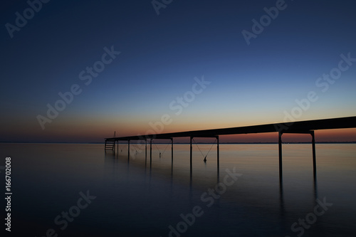   Silence and a beautiful view over the fjord from Vadum beach in Denmark at midnight - one hour after sunset            photo
