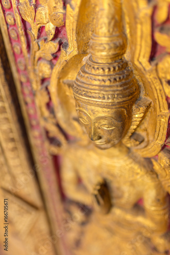 Beautiful golden carving on the door of Wat Sensoukharam temple in Luang Prabang, Laos