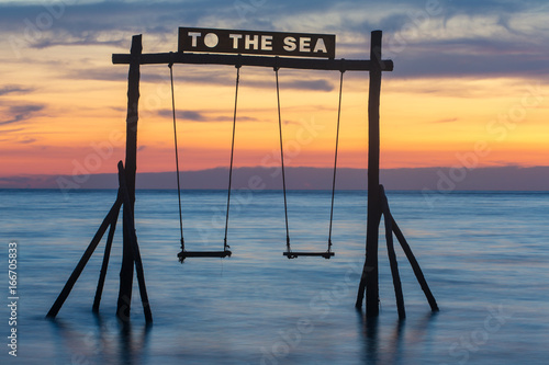 Wooden swing on the beach of Koh Kood island in Thailand. photo