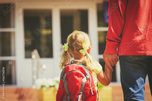 father and little daughter go to school or daycare