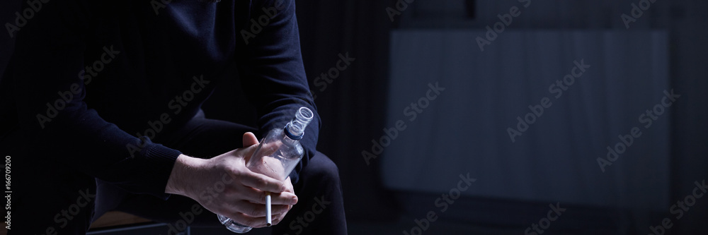 Man with cigarette and vodka Man with cigarette and vodka