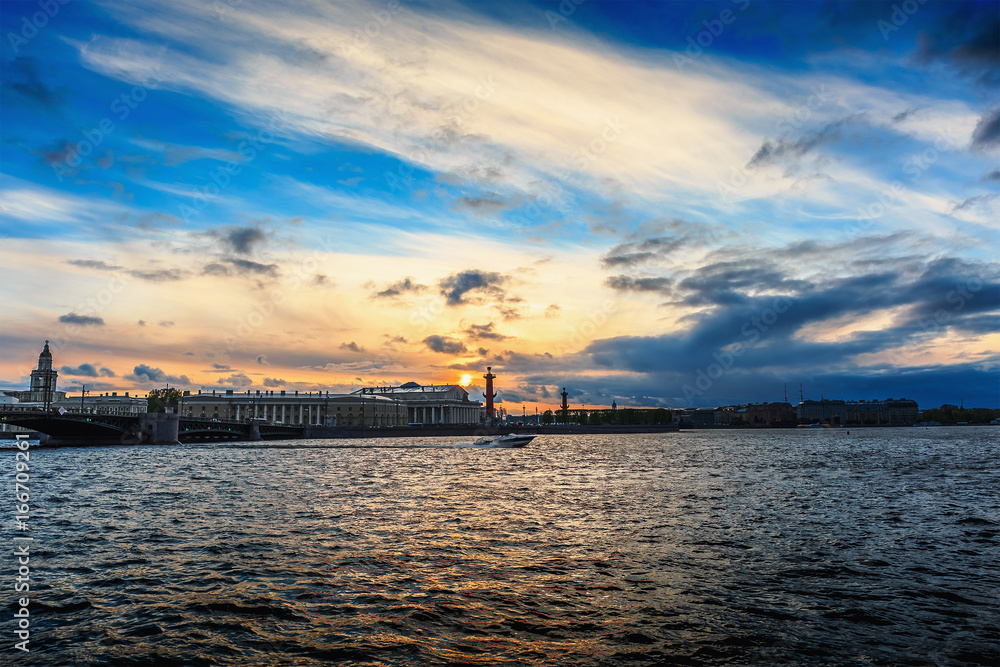 View of the Vasilievsky island at sunset, Neva river, beautiful colorful urban landscape, St. Petersburg