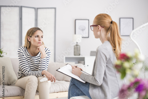 Thoughtful woman having psychologist session