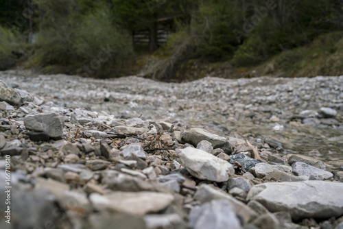 Photos Rough stones and rock chips on the ground viewed low angle with copy space above