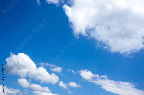 Beautiful blue sky with clouds. Nature Background. Outdoors on summer day.