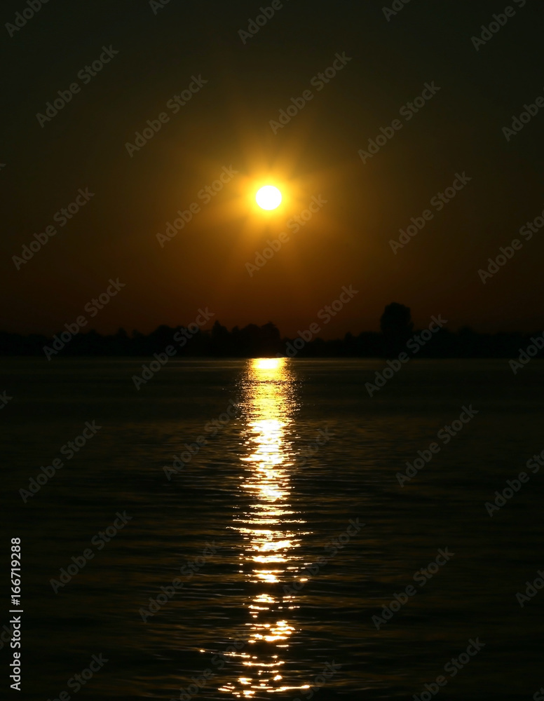 sun at the SUNSET with reflections on the water of the Adriatic