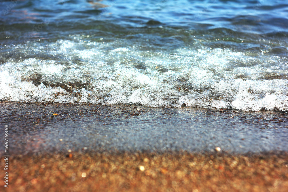 Sea, ocean waves with foam on the sand. Vacation at the beach Sea, ocean waves with foam on the sand. Vacation at the beach