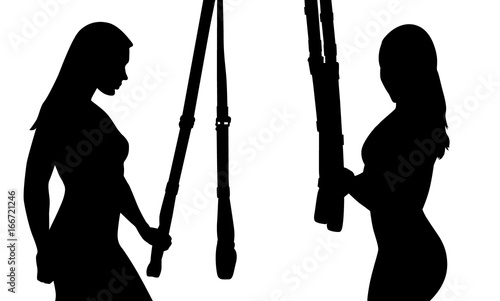 Two silhouette of sporty girl. TRX suspension training.