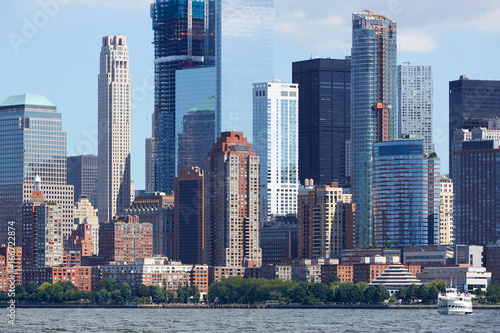 New York City Manhattan view from Hudson river with skyscrapers in a clear sunny day