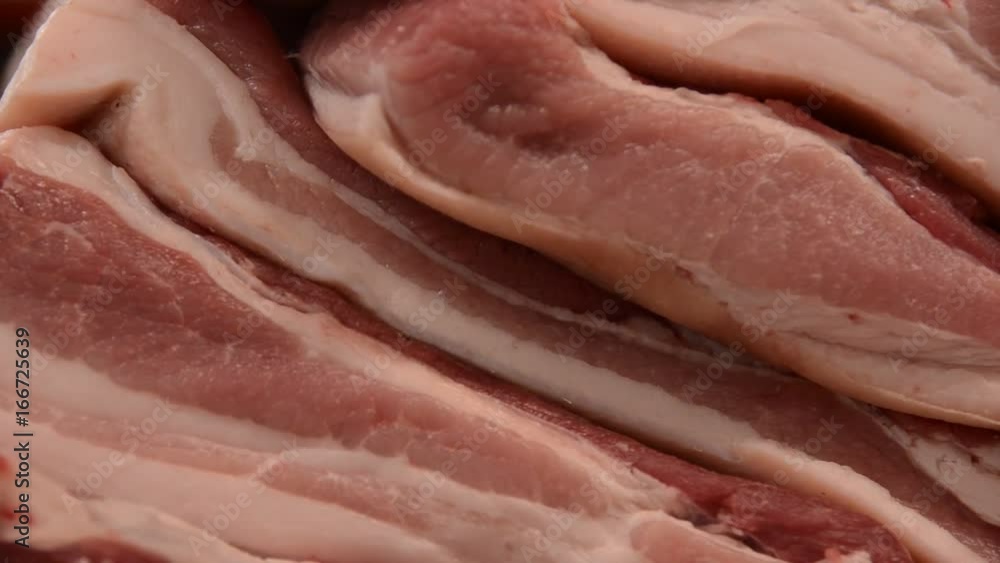 Zoom out, stacked raw pork in kitchen Zoom out, stacked raw pork in kitchen