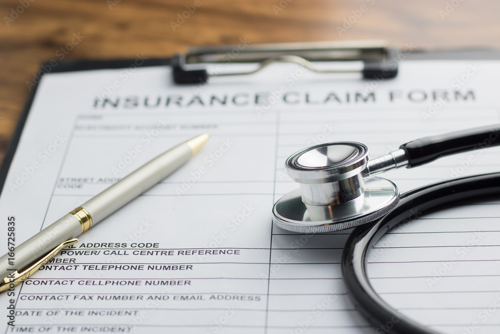 health insurance claim form with stethoscope on wood table selective focus health insurance claim form with stethoscope on wood table selective focus