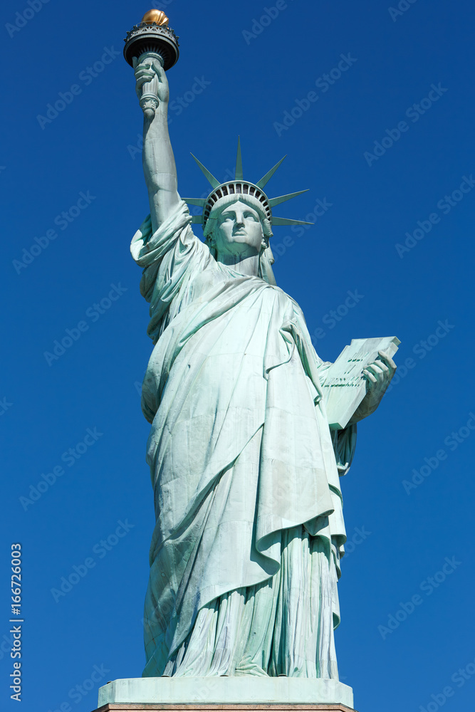 Statue of Liberty, front view in a sunny day, blue sky in New York