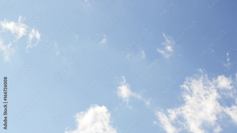 Timelapse, low angle of clouds in blue sky Timelapse, low angle of clouds in blue sky