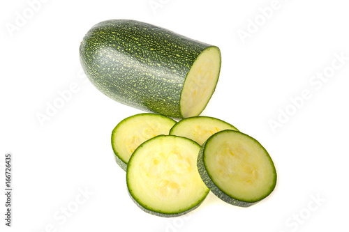 Green zucchini, sliced on white background