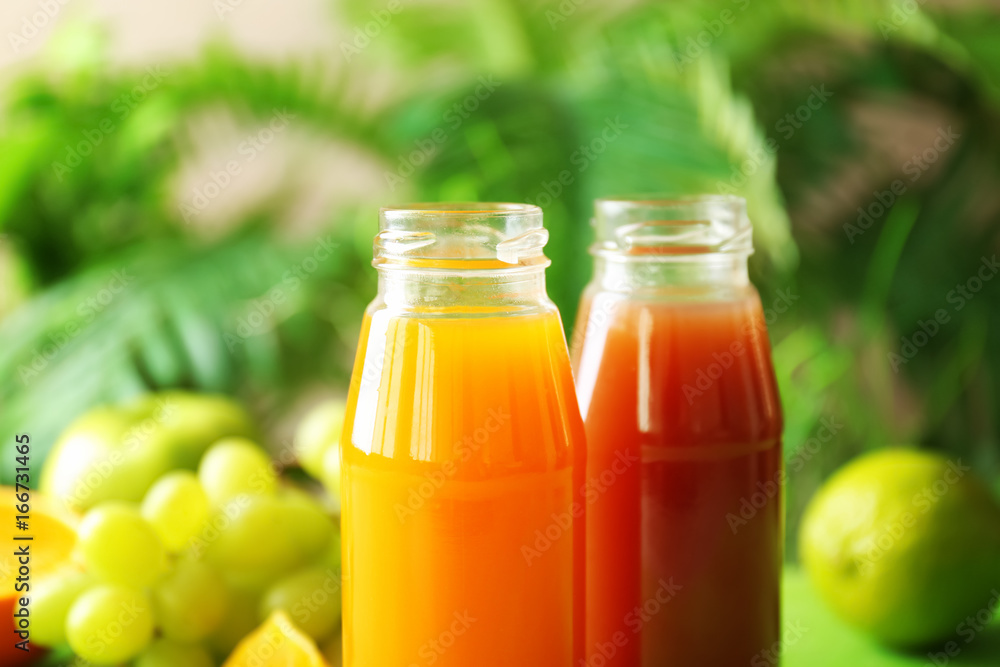 Delicious juices in bottles, closeup Delicious juices in bottles, closeup