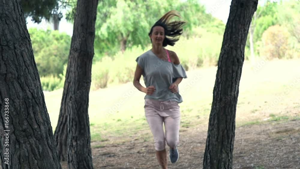 Young woman jogging in park, super slow motion 240fps
Young woman jogging in park, super slow motion 240fps