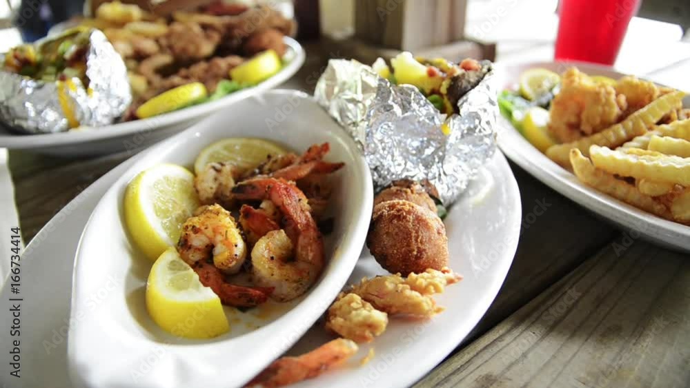 Pan left, close up of various shrimp appetizers on table Pan left, close up of various shrimp appetizers on table