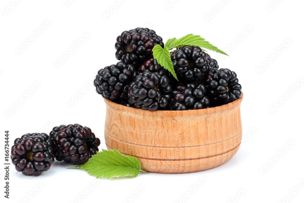 blackberries in wooden bowl isolated on white background blackberries in wooden bowl isolated on white background