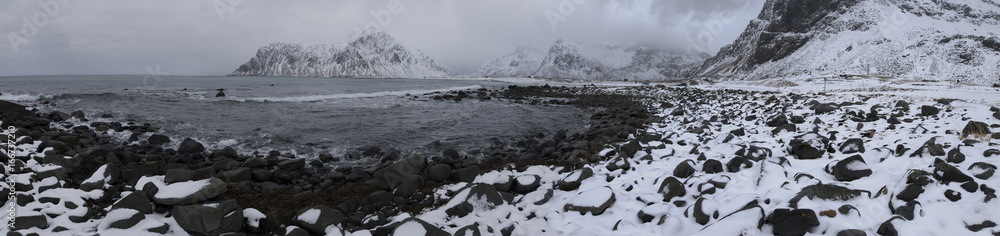 Travel Ideas and Destinations. Panoramic View of Beautiful Snowy Haukland Utaklev Beach at Lofoten Islands in Norway at Early Spring Time.