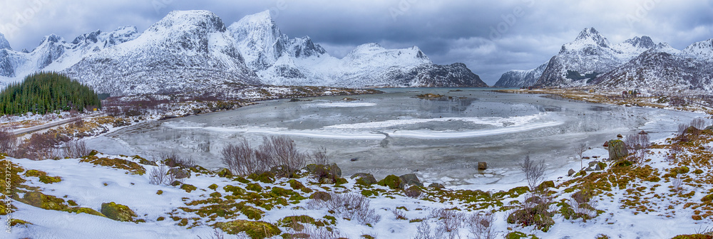 Travel Ideas and Destinations. Panoramic View of Beautiful Snowy Haukland Utaklev Beach at Lofoten Islands in Norwa at Early Spring Time.