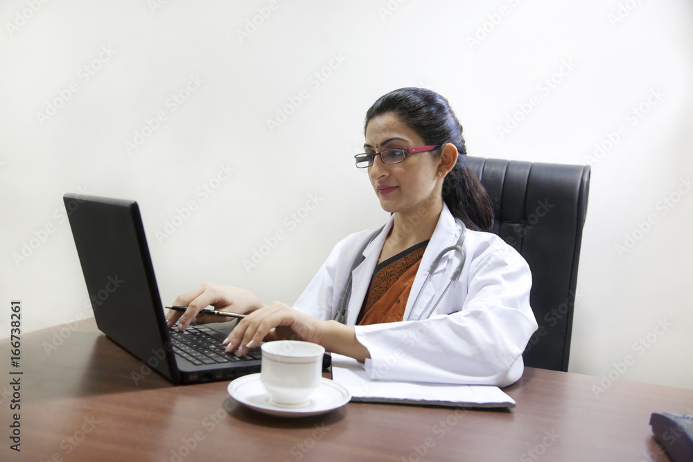 Doctor working on a laptop Doctor working on a laptop
