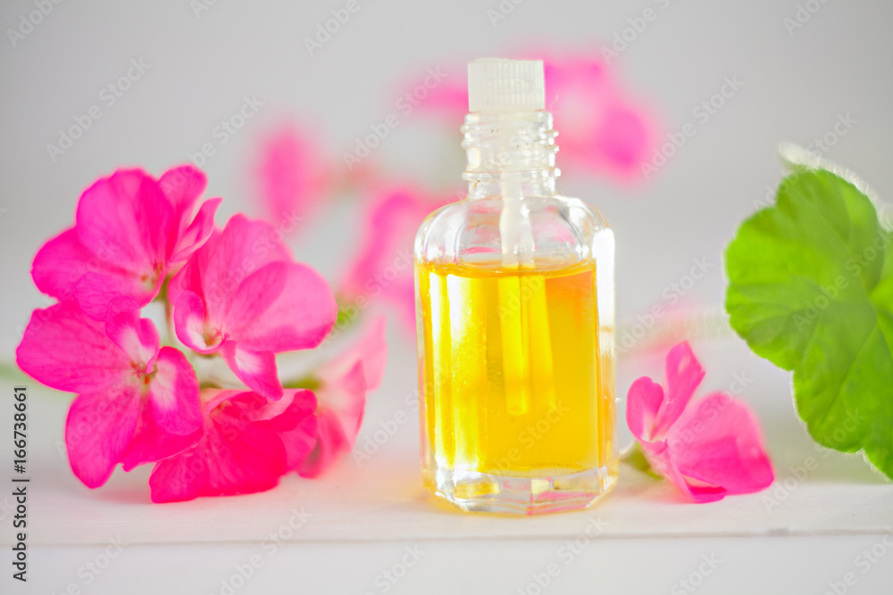 Essence of flowers on table in beautiful glass jar Essence of flowers on table in beautiful glass jar