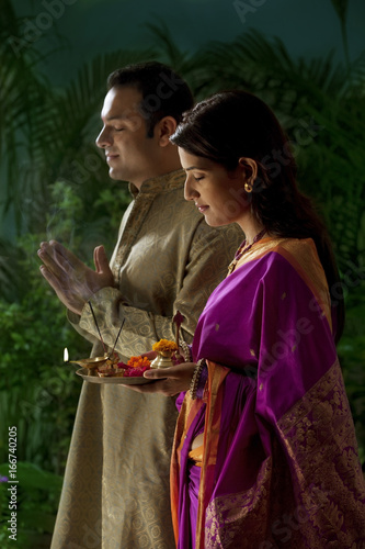 Couple praying during diwali  photo