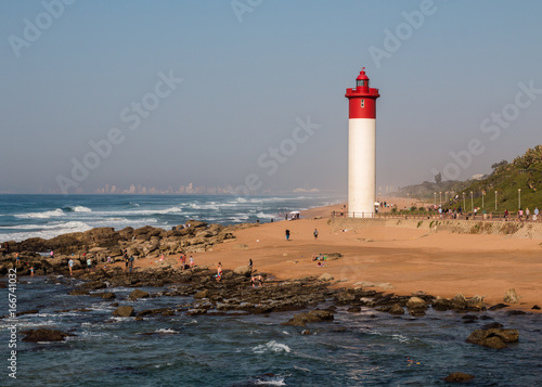 Lighthouse at Umhlanga Rocks in South Africa, landmark coastline landscape.