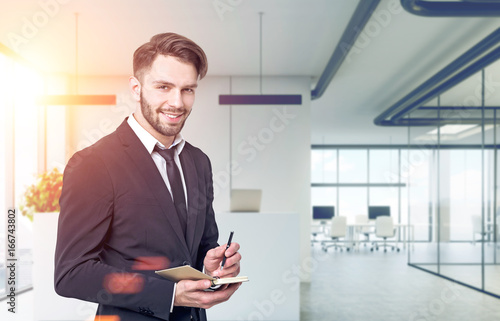 Smiling buisnessman in an office lobby