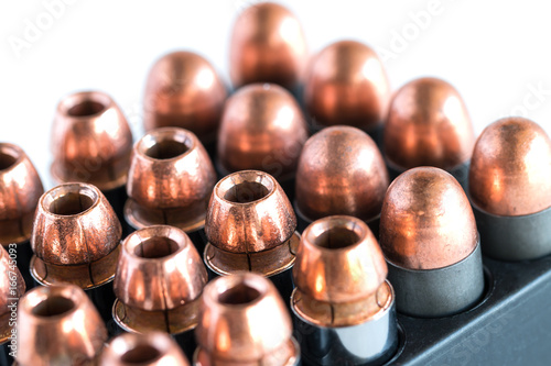 .45 Pistol bullets in a cartridge holder.