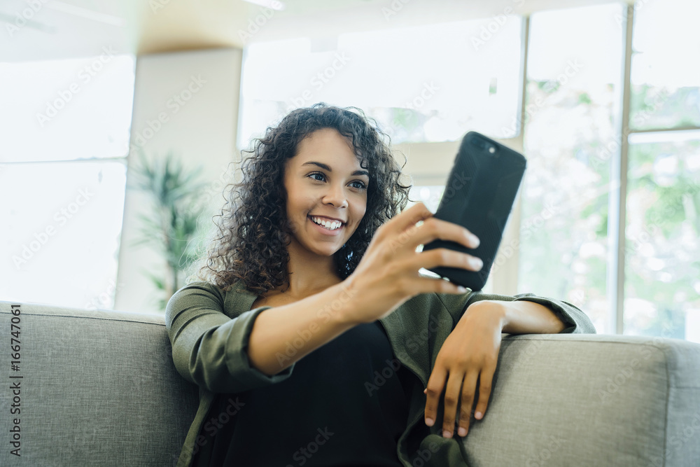 Woman taking selfie on cell phone Woman taking selfie on cell phone