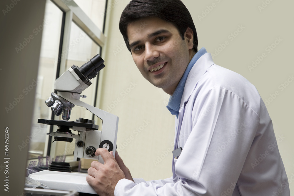 Portrait of a doctor with a microscope Portrait of a doctor with a microscope