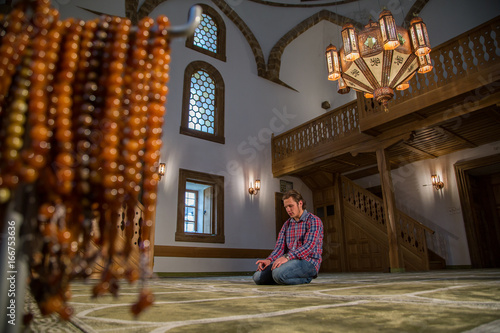 Muslim praying in a mosque © amino visuals