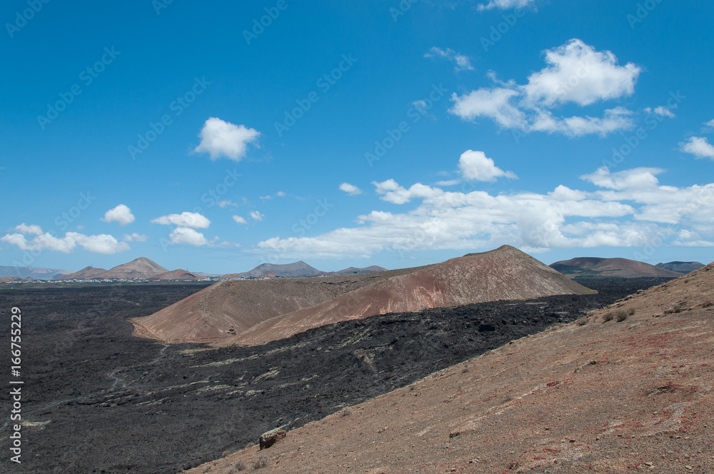 Volcanic cone surrounded by ancient basaltic lava flows, Lanzarote, Canary Islands