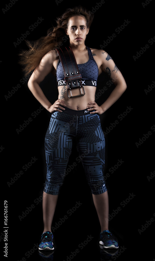 powerful fitness latina woman stand proudly powerful fitness latina woman stand proudly