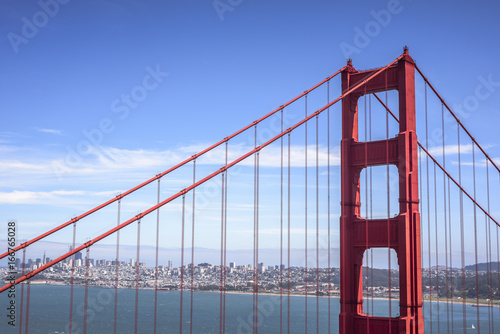 First tower of the Golden Gate Bridge and San Francisco downtown in the sunny day