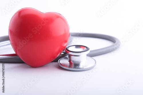 Red heart and a stethoscope isolated on white background