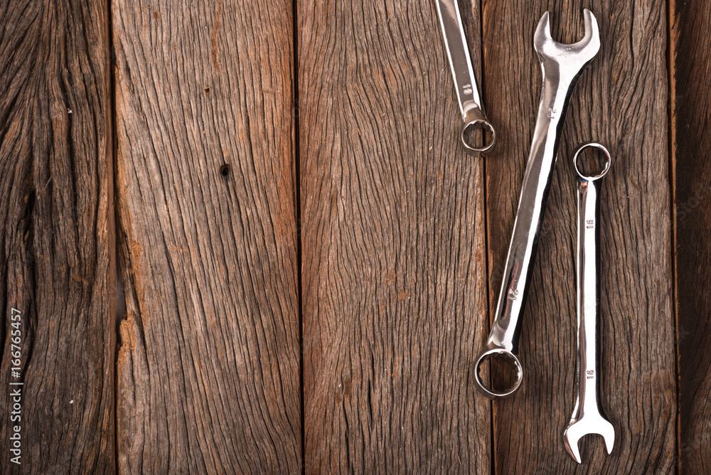 wrenches on wooden background wrenches on wooden background