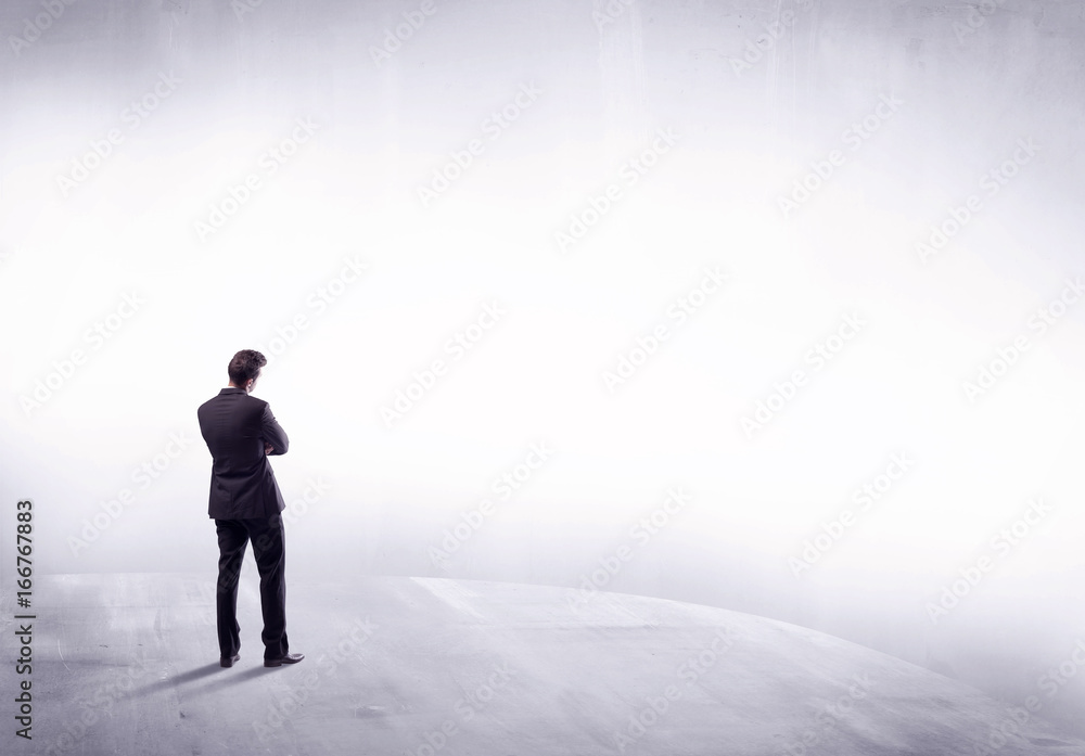 Business person standing from rear view