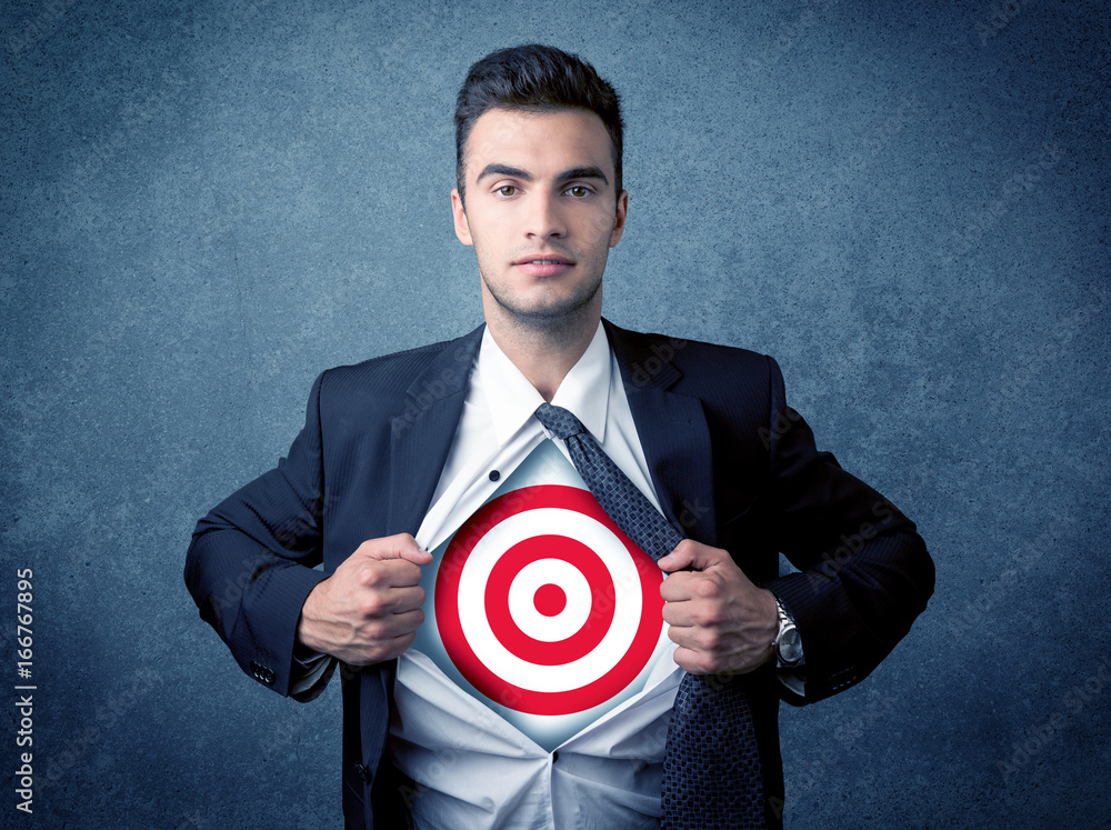 Businessman tearing shirt with target sign on his chest Businessman tearing shirt with target sign on his chest
