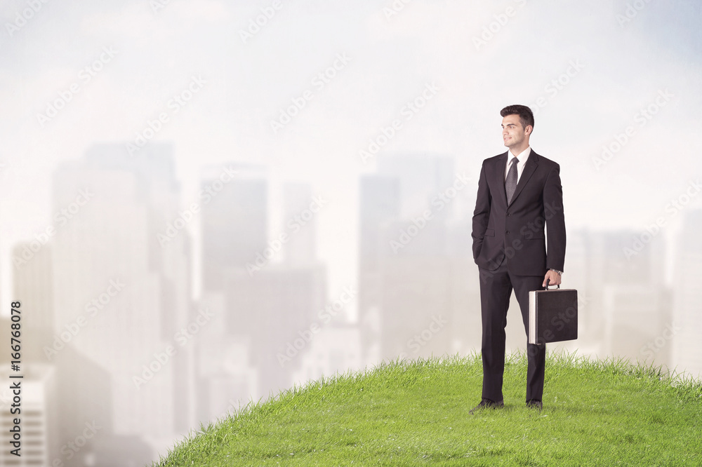 man standing in front of city landscape man standing in front of city landscape