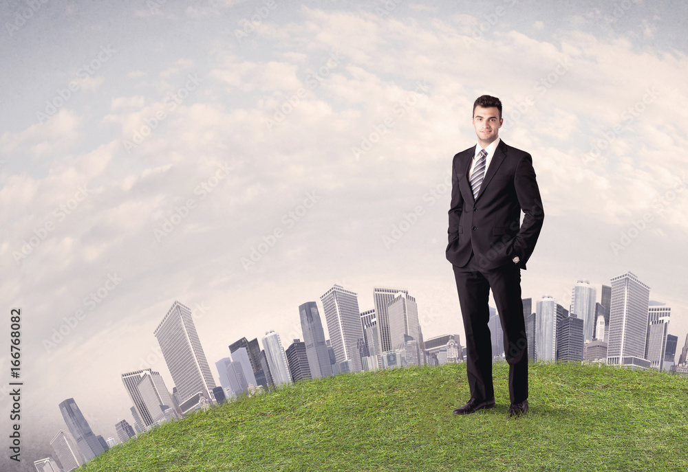 man standing in front of city landscape man standing in front of city landscape