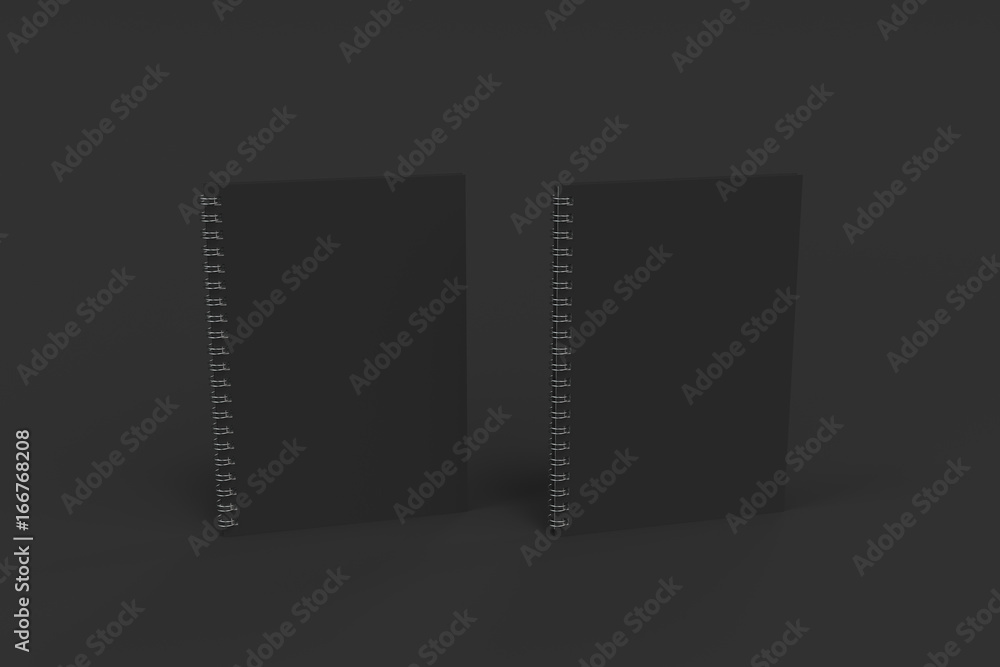 Obraz premium Two notebooks with spiral bound on black background