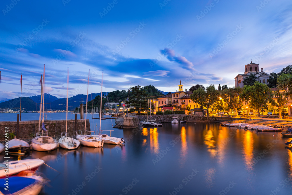Lake Maggiore, Laveno, north Italy. View at sunrise of the beautiful small and old harbor and of the lakeside promenade of Laveno, province of Varese
