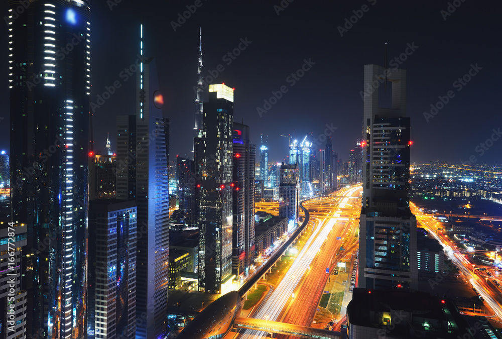 Fototapeta premium Elevated cityscape of Sheikh Zayed Road in Dubai at night