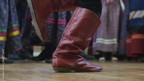 Russian folk dance - foot in boots of boy dancing