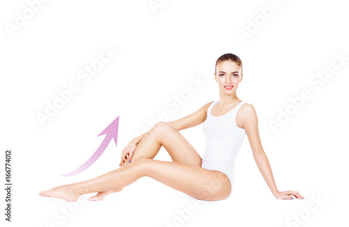 Beautiful, young and sporty girl with arrows isolated on white. Health, sport, fitness, nutrition, weight loss, diet, cellulite removal, liposuction, healthy life-style concept.