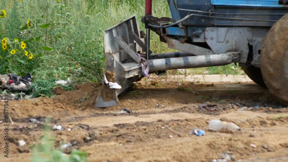Truck with ladle cover rubbish with earth Truck with ladle cover rubbish with earth
