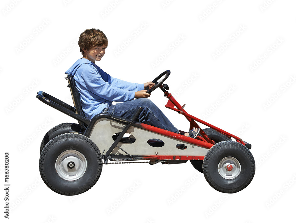 Young boy driving a Quadricycle